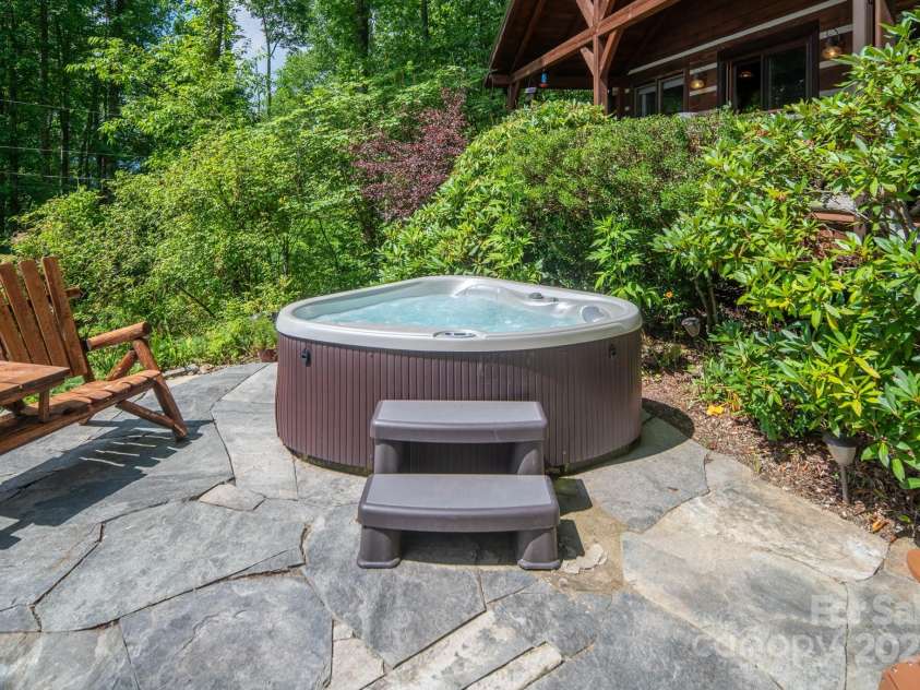 55 Bearwallow Road, Leicester, NC 28748.  MLS# CAR4278949, YatesRealty ID 24812. Patio and Hot Tub