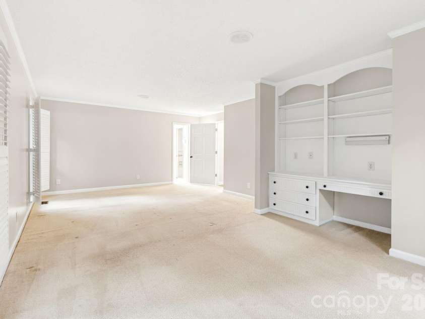2804 Wimbledon Drive, Gastonia, NC 28056.  MLS# CAR4376535, YatesRealty ID 24815. Main floor primary bedroom with built-ins.