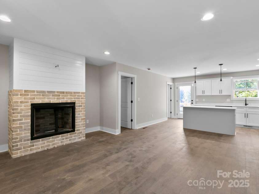 118 Muse Ridge Drive, Candler, NC 28715.  MLS# CAR4276670, YatesRealty ID 24817. Living & Kitchen