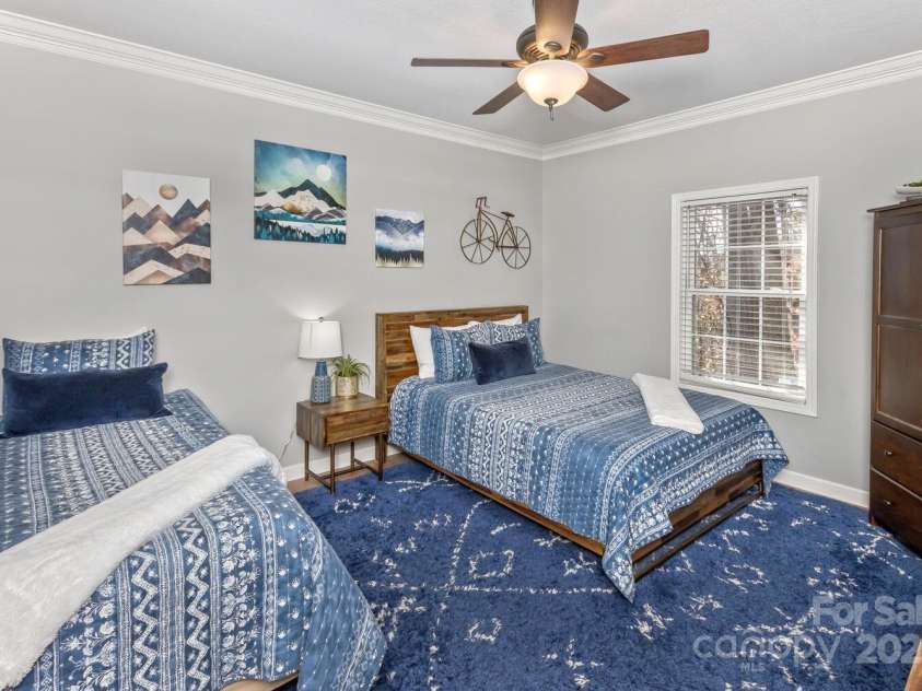 909 Town Mountain Road, Asheville, NC 28804.  MLS# CAR4233490, YatesRealty ID 2483. On the main level, this bedroom is adjacent to full bath that also is easily accessed from the kitchen/dining/living areas.