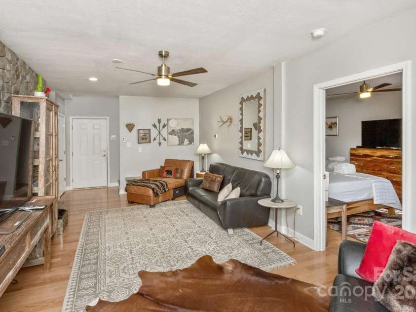 909 Town Mountain Road, Asheville, NC 28804.  MLS# CAR4233490, YatesRealty ID 2483. The lower level family room has easy access to the garage.