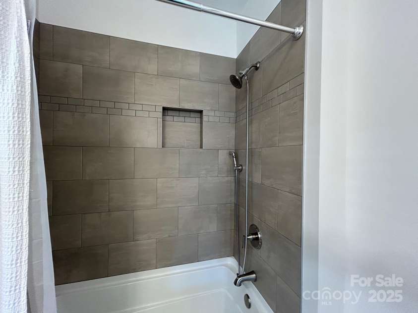 24 Wheeler Road, Weaverville, NC 28787.  MLS# CAR4252449, YatesRealty ID 24830. Primary Bathroom with upgraded tile surround and soaker tub