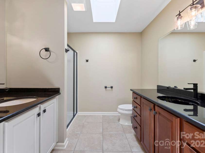 241 Fairway View Drive, Etowah, NC 28729.  MLS# CAR4304614, YatesRealty ID 2484. Primary Bath with double sinks and Shower