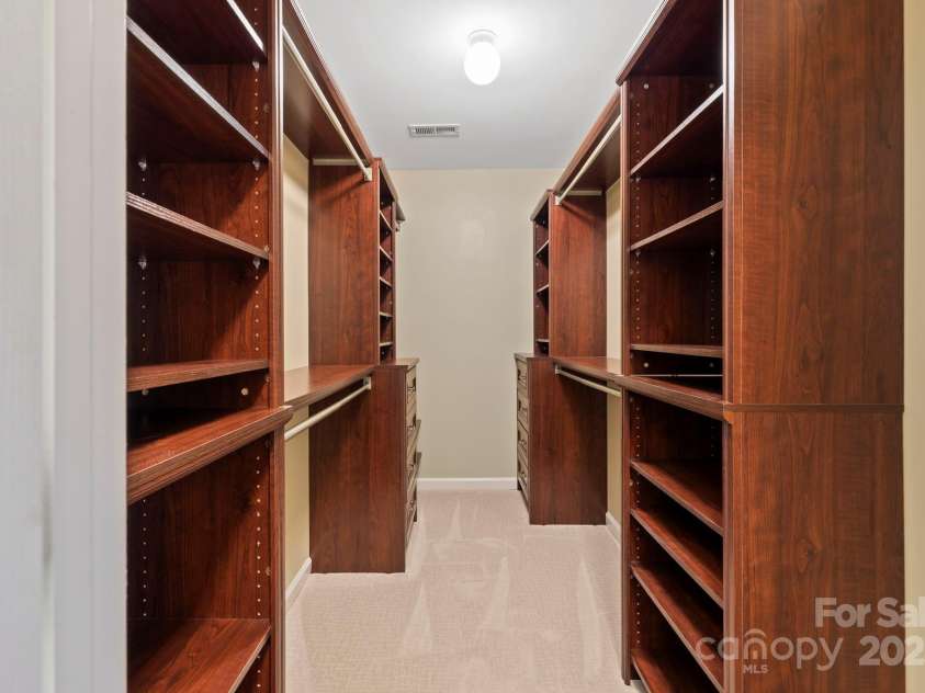 241 Fairway View Drive, Etowah, NC 28729.  MLS# CAR4304614, YatesRealty ID 2484. Primary Closet with wood organization system