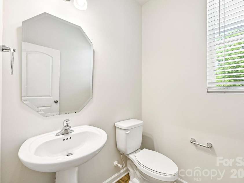 1325 Southern Sugar Drive, Charlotte, NC 28262.  MLS# CAR4381363, YatesRealty ID 24842. Main level half bath