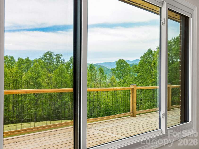 195 Red Bird Road, Spruce Pine, NC 28777.  MLS# CAR4380528, YatesRealty ID 24850. Dining area window~ long range views