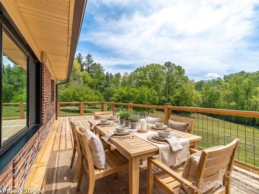 195 Red Bird Road, Spruce Pine, NC 28777.  MLS# CAR4380528, YatesRealty ID 24850. Dining on the deck~ virtually staged