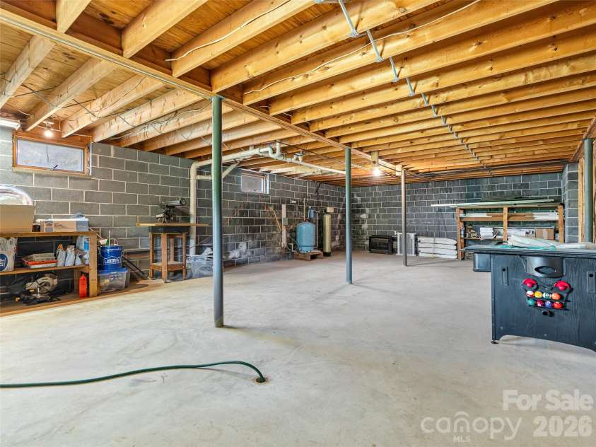 195 Red Bird Road, Spruce Pine, NC 28777.  MLS# CAR4380528, YatesRealty ID 24850. Huge workshop space in walkout basement
