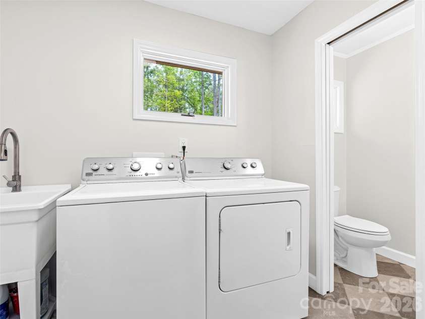 195 Red Bird Road, Spruce Pine, NC 28777.  MLS# CAR4380528, YatesRealty ID 24850. Main level laundry with utility sink and half bath