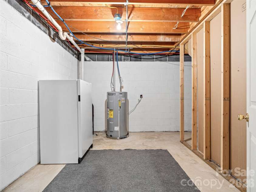 195 Red Bird Road, Spruce Pine, NC 28777.  MLS# CAR4380528, YatesRealty ID 24850. More basement storage on opposite side from workshop