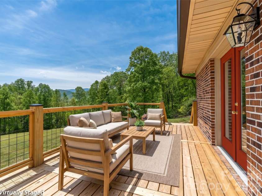 195 Red Bird Road, Spruce Pine, NC 28777.  MLS# CAR4380528, YatesRealty ID 24850. Spacious deck~ virtually staged
