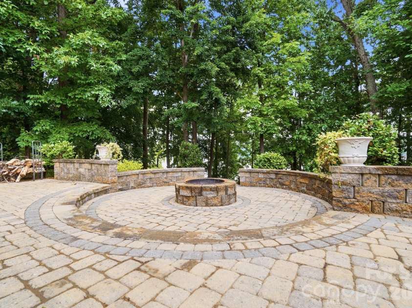221 Whiterock Drive, Mount Holly, NC 28120.  MLS# CAR4374843, YatesRealty ID 24854. Fire pit and paver pation