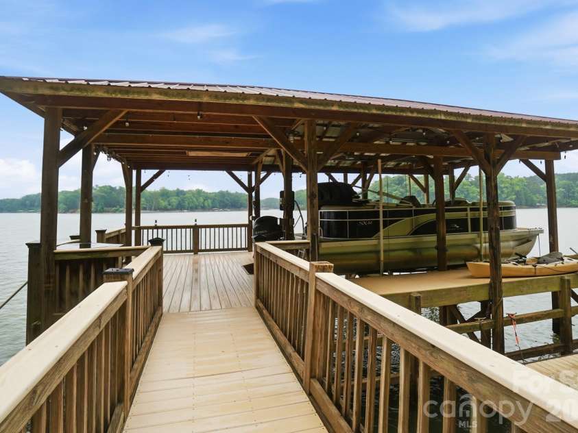 221 Whiterock Drive, Mount Holly, NC 28120.  MLS# CAR4374843, YatesRealty ID 24854. Stationary dock with trex decking