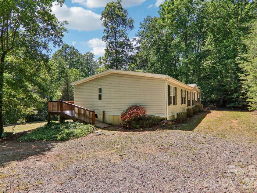 125 Cove Creek Drive, Rutherfordton, NC 28139.  MLS# CAR4384010, YatesRealty ID 24863. Home sits back from rd. Ample parking