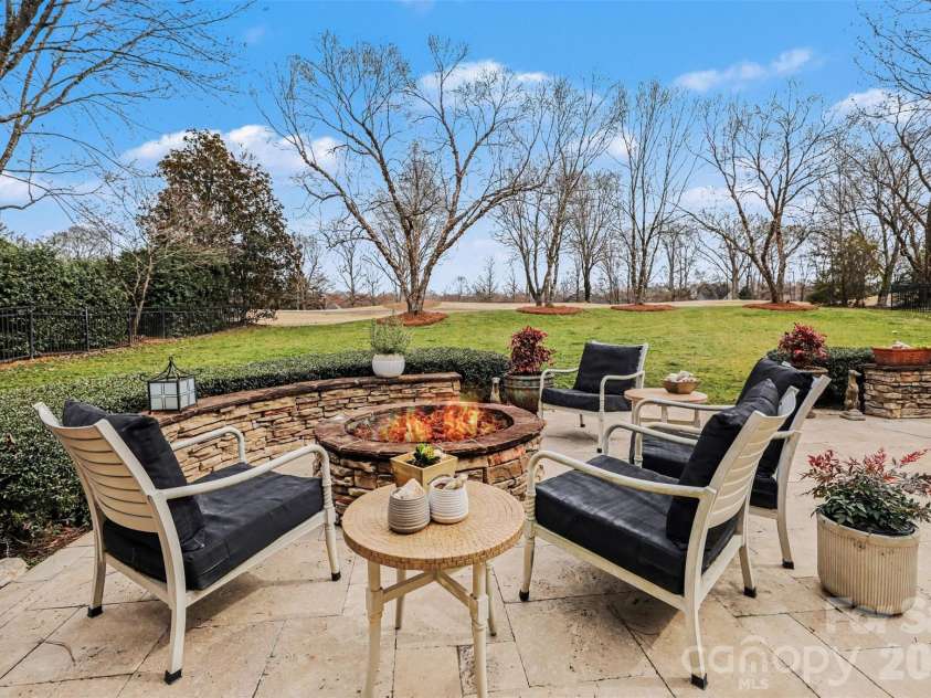 6919 Seton House Lane, Charlotte, NC 28277.  MLS# CAR4350375, YatesRealty ID 2487. Backyard with firepit
