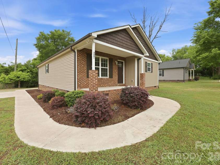 2601 Penninger Road, Concord, NC 28025.  MLS# CAR4381603, YatesRealty ID 24870. Concrete sidewalks and driveway is a nice touch