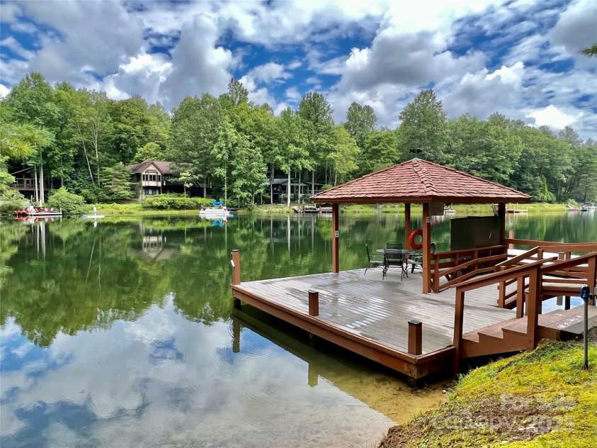 92 Nodatsi Court, Brevard, NC 28712.  MLS# CAR4268723, YatesRealty ID 24873. 4 stream fed lakes for swimming, boating & fishing