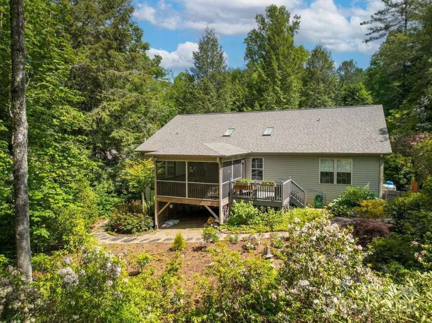 92 Nodatsi Court, Brevard, NC 28712.  MLS# CAR4268723, YatesRealty ID 24873. Back exterior of home