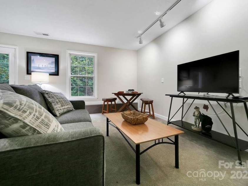 92 Nodatsi Court, Brevard, NC 28712.  MLS# CAR4268723, YatesRealty ID 24873. Lower level bonus room.. theater room?  Craft room?