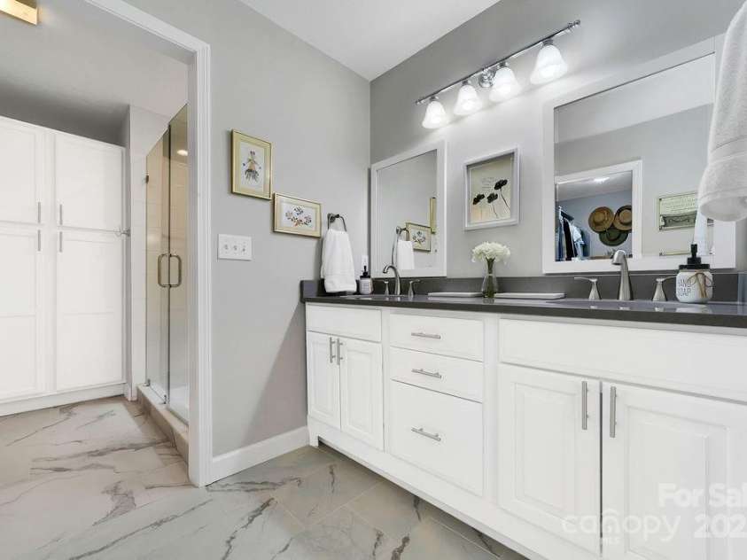 92 Nodatsi Court, Brevard, NC 28712.  MLS# CAR4268723, YatesRealty ID 24873. Primary bath boasts custom tile