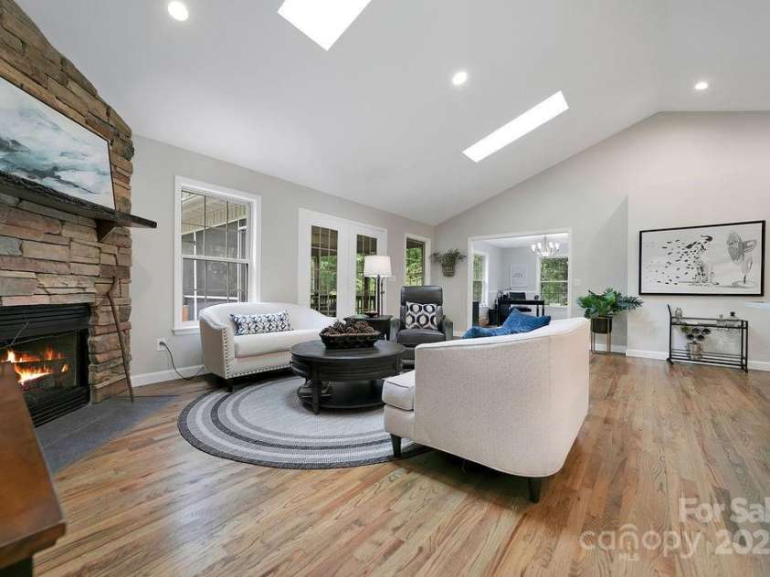 92 Nodatsi Court, Brevard, NC 28712.  MLS# CAR4268723, YatesRealty ID 24873. Screened porch off of the living room extends living area...