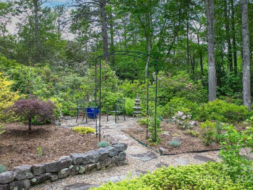 92 Nodatsi Court, Brevard, NC 28712.  MLS# CAR4268723, YatesRealty ID 24873. So many options in this gardener's oasis...