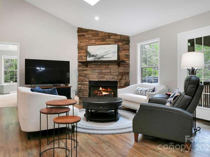 92 Nodatsi Court, Brevard, NC 28712.  MLS# CAR4268723, YatesRealty ID 24873. Stone fireplace with gas logs adds ambiance...