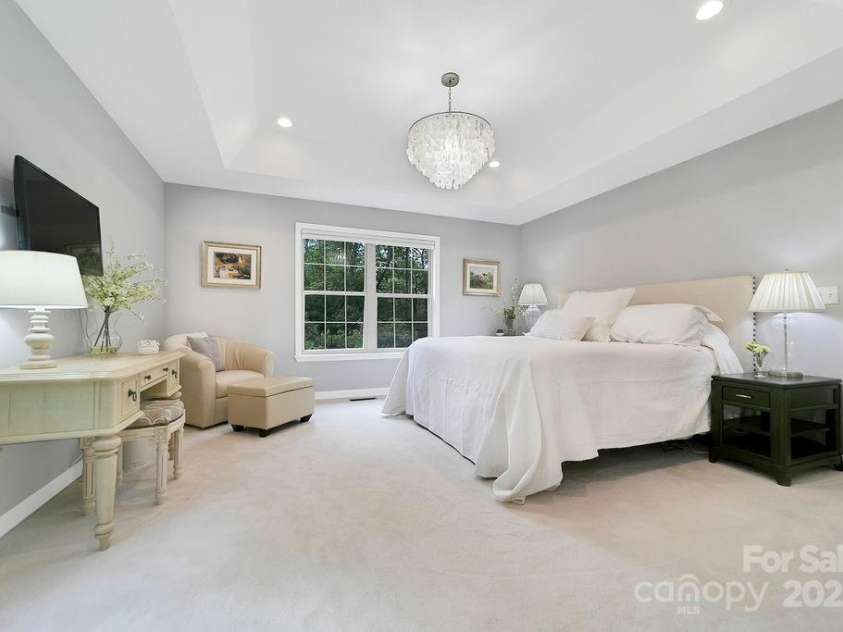 92 Nodatsi Court, Brevard, NC 28712.  MLS# CAR4268723, YatesRealty ID 24873. Tray ceiling, chandelier & privacy