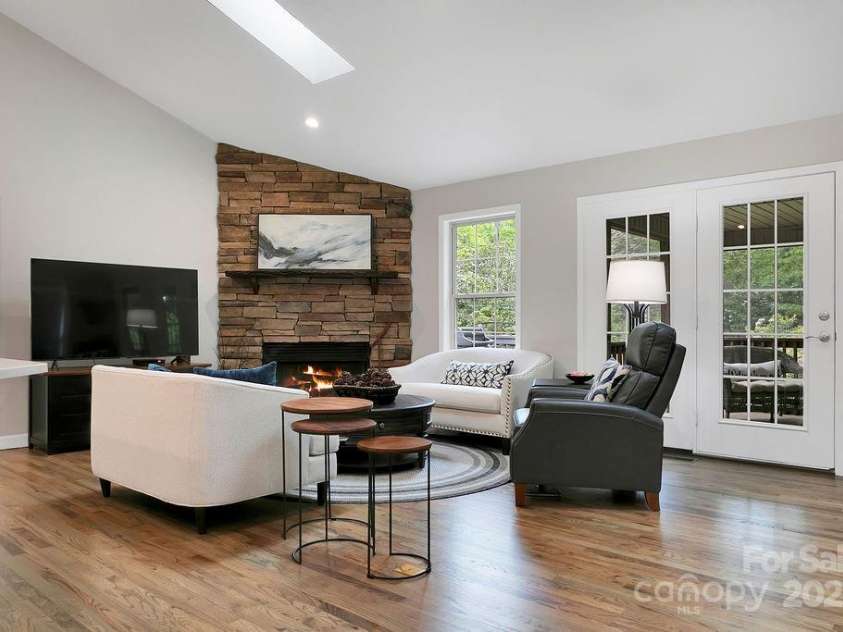 92 Nodatsi Court, Brevard, NC 28712.  MLS# CAR4268723, YatesRealty ID 24873. Windows & doors facing the back yard gardens