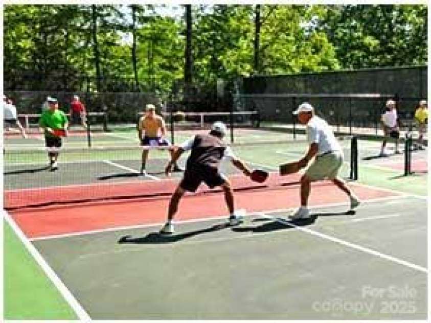 216 Tinequa Drive, Brevard, NC 28712.  MLS# CAR4275576, YatesRealty ID 24874. Pickle ball is a popular sport in Connestee Falls!