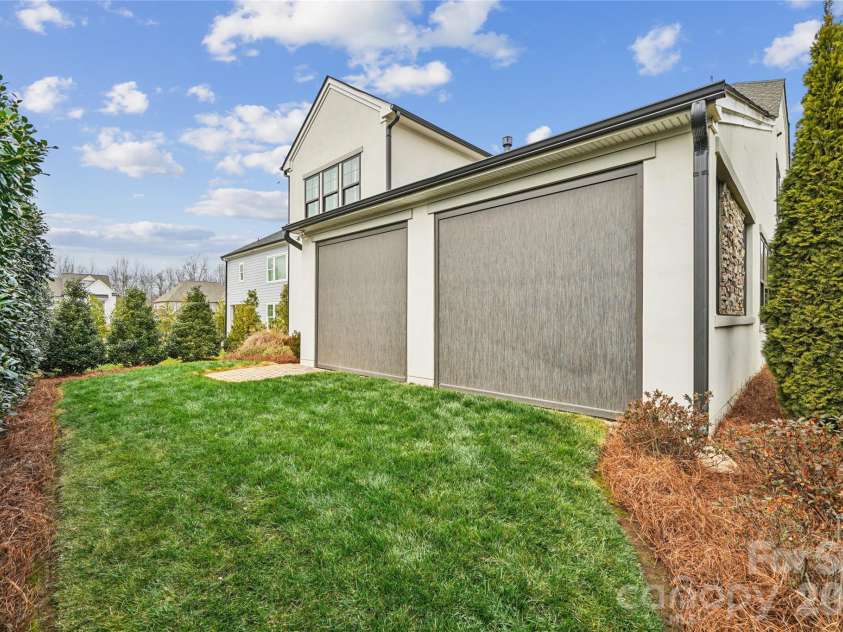 1016 Thatcher Way, Fort Mill, SC 29715.  MLS# CAR4337536, YatesRealty ID 24880. Low Maintenance Backyard With Privacy screens