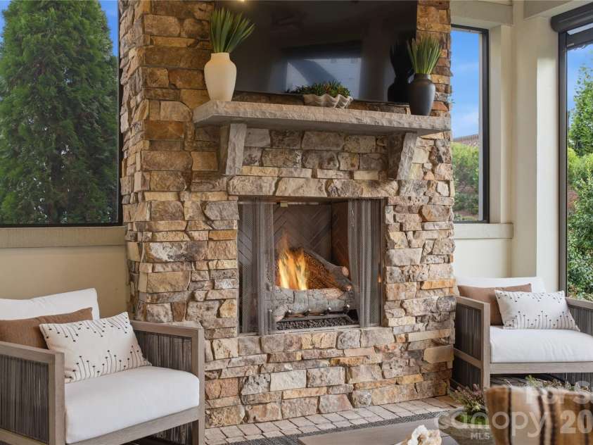 1016 Thatcher Way, Fort Mill, SC 29715.  MLS# CAR4337536, YatesRealty ID 24880. Stacked Stone Outdoor Fireplace