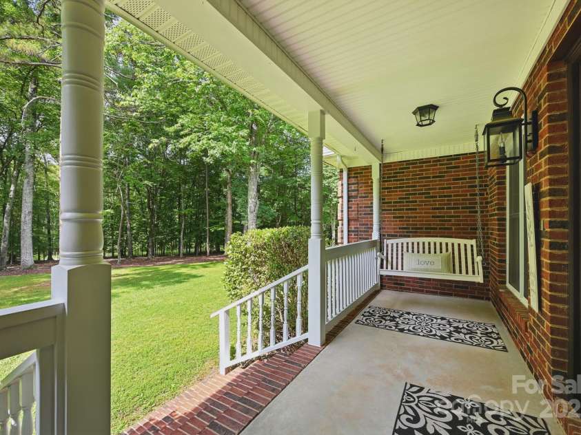 4824 Waxhaw Farms Road, Waxhaw, NC 28173.  MLS# CAR4270234, YatesRealty ID 24893. Ahhhh...we all love a southern front porch with a swing!