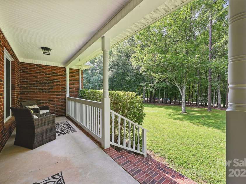4824 Waxhaw Farms Road, Waxhaw, NC 28173.  MLS# CAR4270234, YatesRealty ID 24893. Another view of your wonderful front porch...just sit back with a great book and a refreshing beverage while enjoying your day!