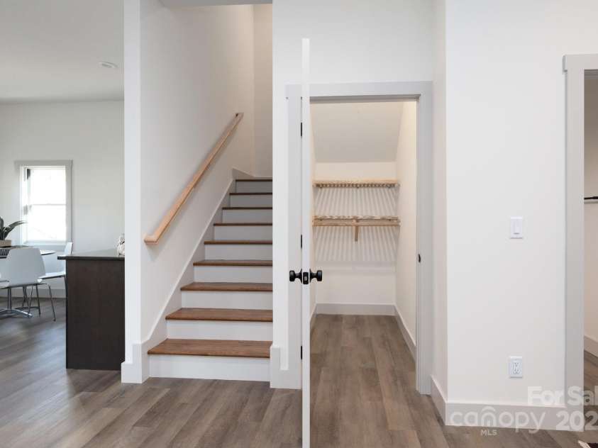 88 Pershing Road, Asheville, NC 28805.  MLS# CAR4204009, YatesRealty ID 24896. Large Storage Closet under Basement Stairs