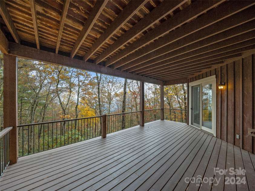 409 Elk Mountain Trail, Brevard, NC 28712.  MLS# CAR4196213, YatesRealty ID 249. Lower level covered deck.