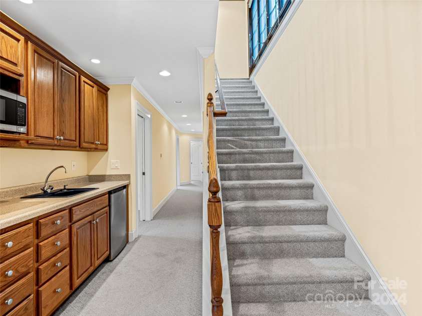 409 Elk Mountain Trail, Brevard, NC 28712.  MLS# CAR4196213, YatesRealty ID 249. Lower level kitchenette.