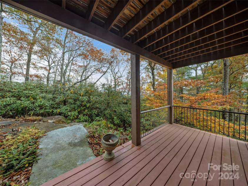409 Elk Mountain Trail, Brevard, NC 28712.  MLS# CAR4196213, YatesRealty ID 249. Patio off Family room with stone pavers.