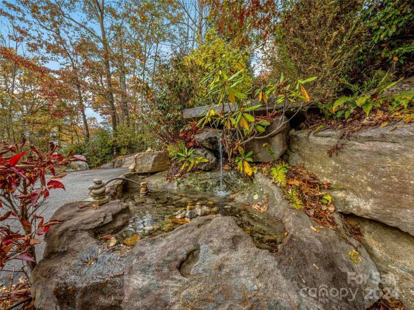 409 Elk Mountain Trail, Brevard, NC 28712.  MLS# CAR4196213, YatesRealty ID 249. Pleasant water feature.