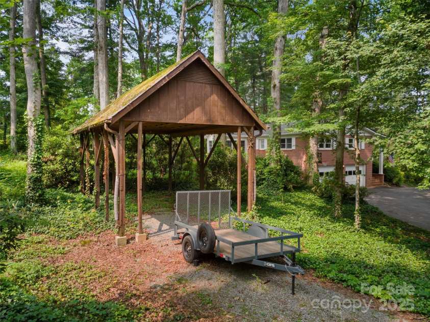 251 Sherwood Lane, Hendersonville, NC 28791.  MLS# CAR4266168, YatesRealty ID 24904. 12ft tall carport, perfect for RV/Boat/ATV storage