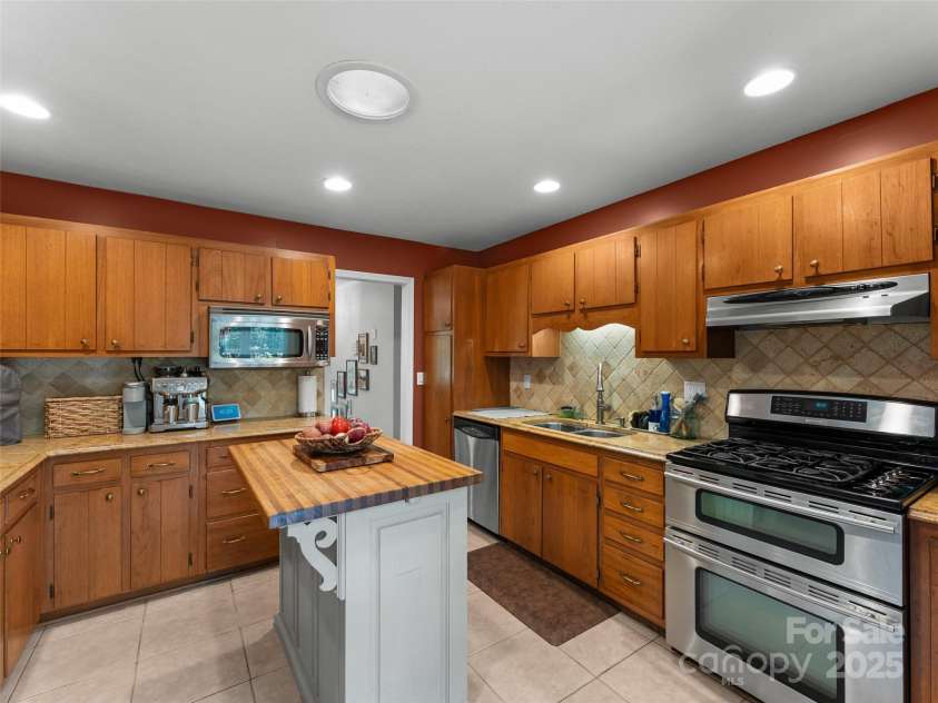 251 Sherwood Lane, Hendersonville, NC 28791.  MLS# CAR4266168, YatesRealty ID 24904. Kitchen with abundance of cabinetry