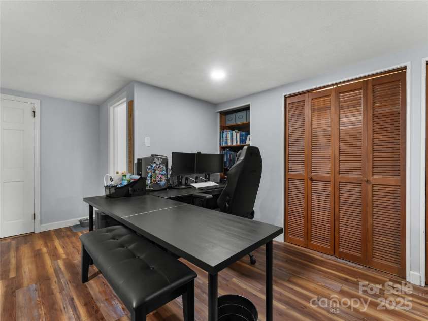 251 Sherwood Lane, Hendersonville, NC 28791.  MLS# CAR4266168, YatesRealty ID 24904. Office Space in Finished part of Basement (with lots of storage)