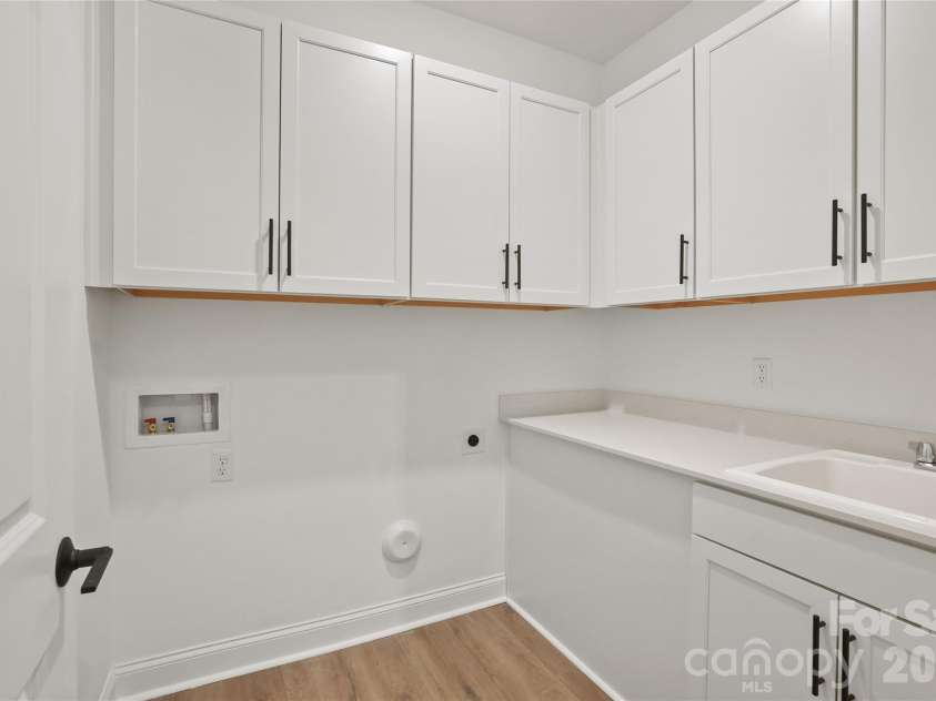 2024 Waxhaw Crossing Drive, Waxhaw, NC 28173.  MLS# CAR4325572, YatesRealty ID 24905. Laundry with Sink