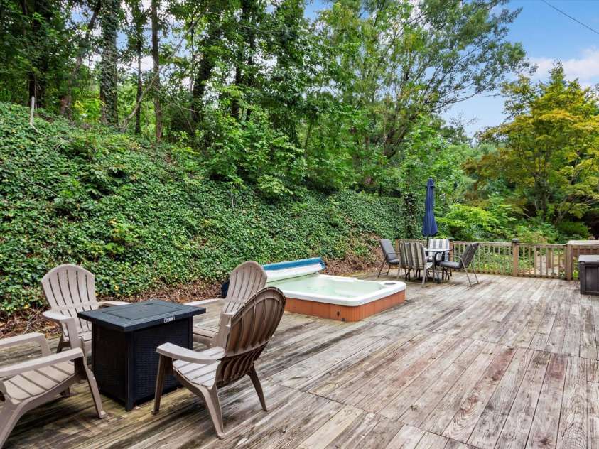 42 Bushwald Lane, Swannanoa, NC 28778.  MLS# CAR4369752, YatesRealty ID 24907. Large back deck with hot tub