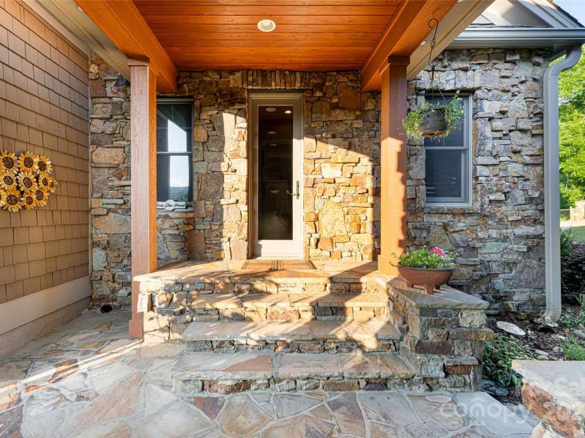 280 Walnut Hollow Road, Brevard, NC 28712.  MLS# CAR4235278, YatesRealty ID 2491. Covered breezeway leading to the oversized 3-car garage