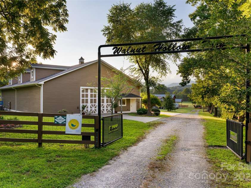 280 Walnut Hollow Road, Brevard, NC 28712.  MLS# CAR4235278, YatesRealty ID 2491. Gated, secondary entrance to barns and guest house