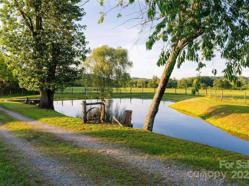 280 Walnut Hollow Road, Brevard, NC 28712.  MLS# CAR4235278, YatesRealty ID 2491. Idyllic pond on property
