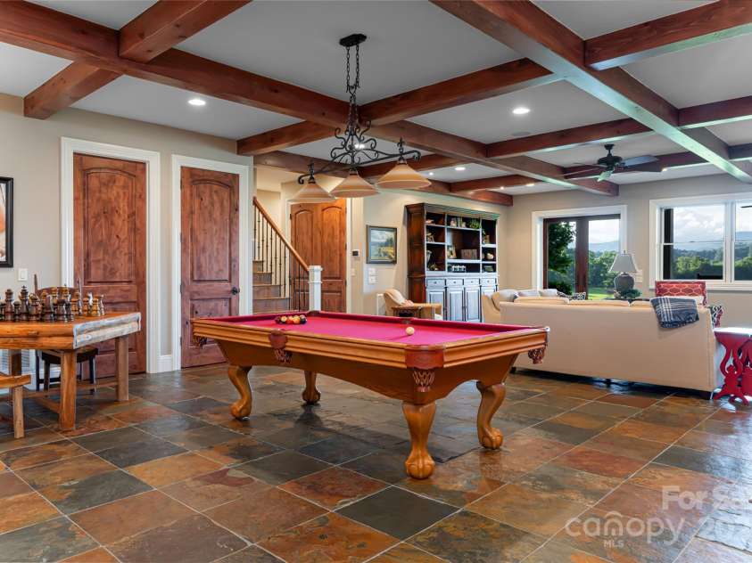 280 Walnut Hollow Road, Brevard, NC 28712.  MLS# CAR4235278, YatesRealty ID 2491. The lower level family room is designed to entertain