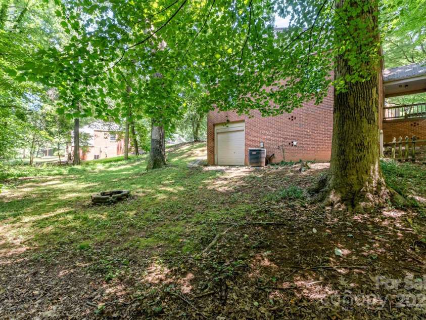 395 Westwood Drive, Statesville, NC 28677.  MLS# CAR4277889, YatesRealty ID 24910. View of home from backyard