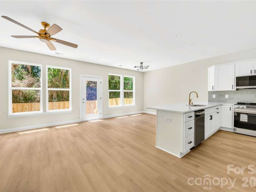 1944 Purser Drive, Charlotte, NC 28215.  MLS# CAR4378594, YatesRealty ID 24916. Kitchen opens to main level living